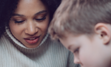 Lady helping child