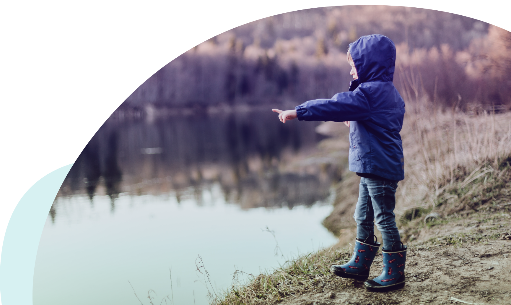 Child next to lake