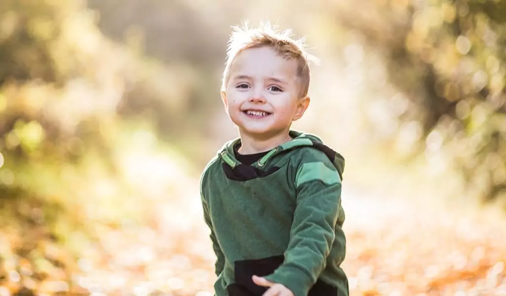 Child running down path