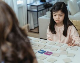 Child and adult playing game