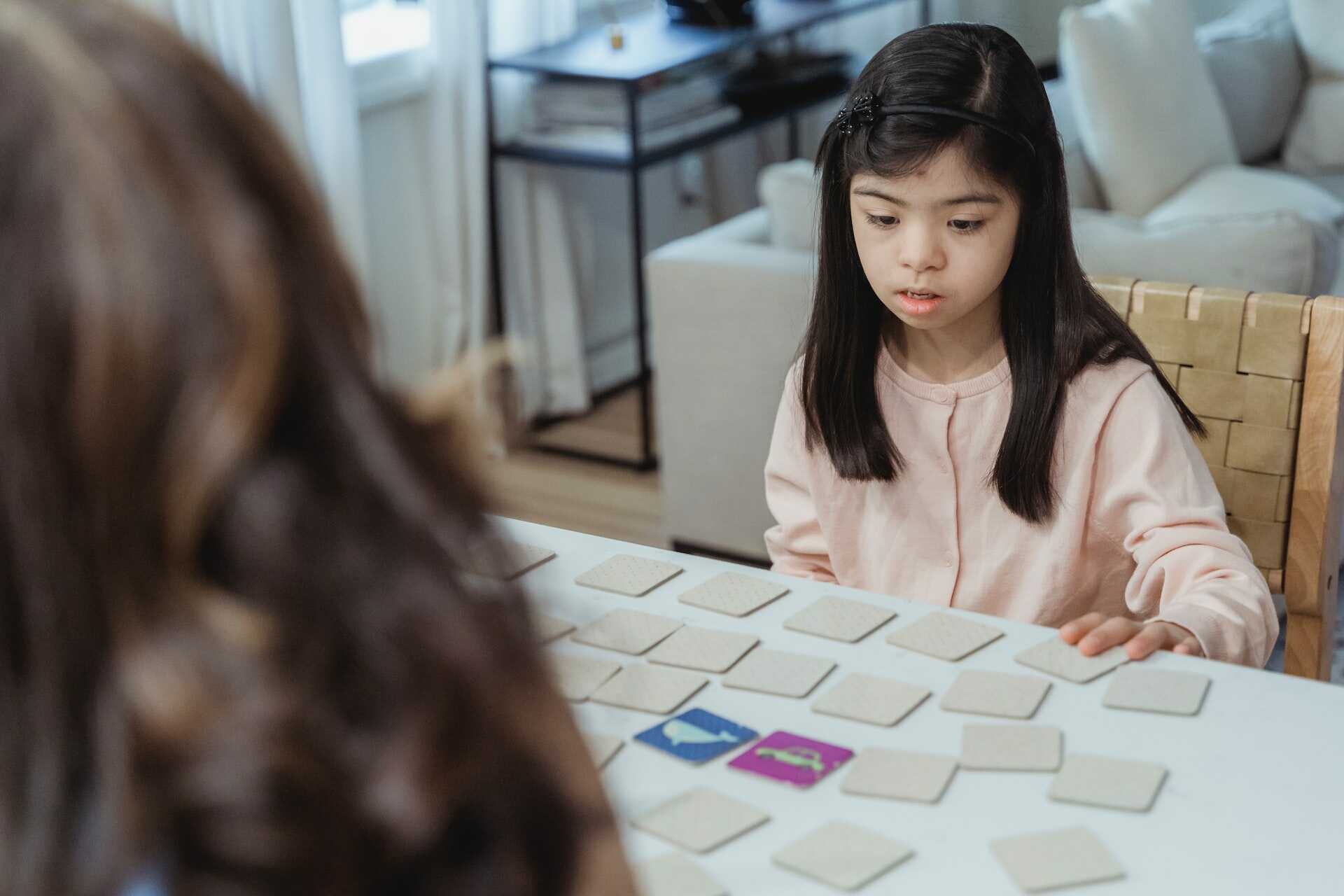 Child and adult playing game