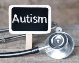 Sign with "Autism" on next to stethoscope