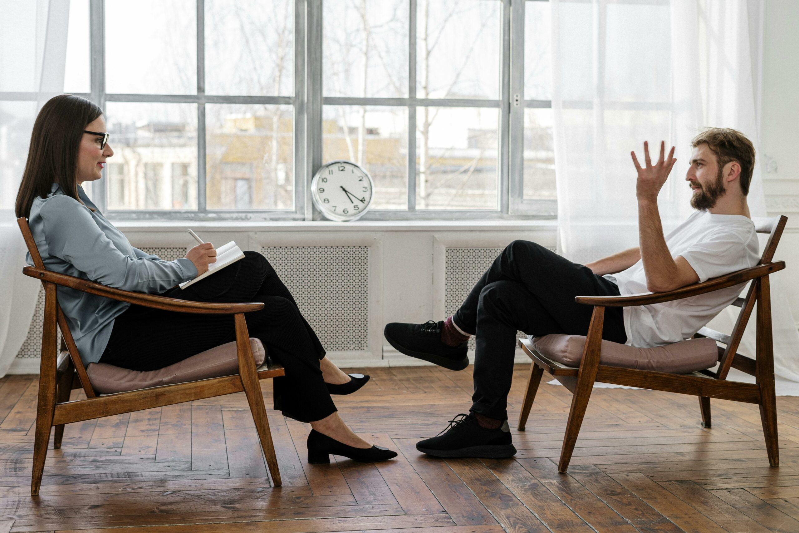 Man and woman talking in appointment